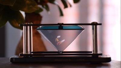 Pixel + The Pixel+ is a small holographic pyramid in a nice black structure. It is specially designed for 4" to 6" smartphones. With this holographic device, you can display small holograms, visible over 360° thanks to an optical illusion which gives the impression that a 3D picture is floating just above your smartphone.